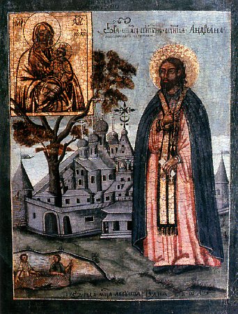 An icon of St Adrian of Poshekhonye, depicting him in front of his monastery wearing layers of warm monastic clothing and his priestly stole while he in turn looks upon an icon of the Theotokos.